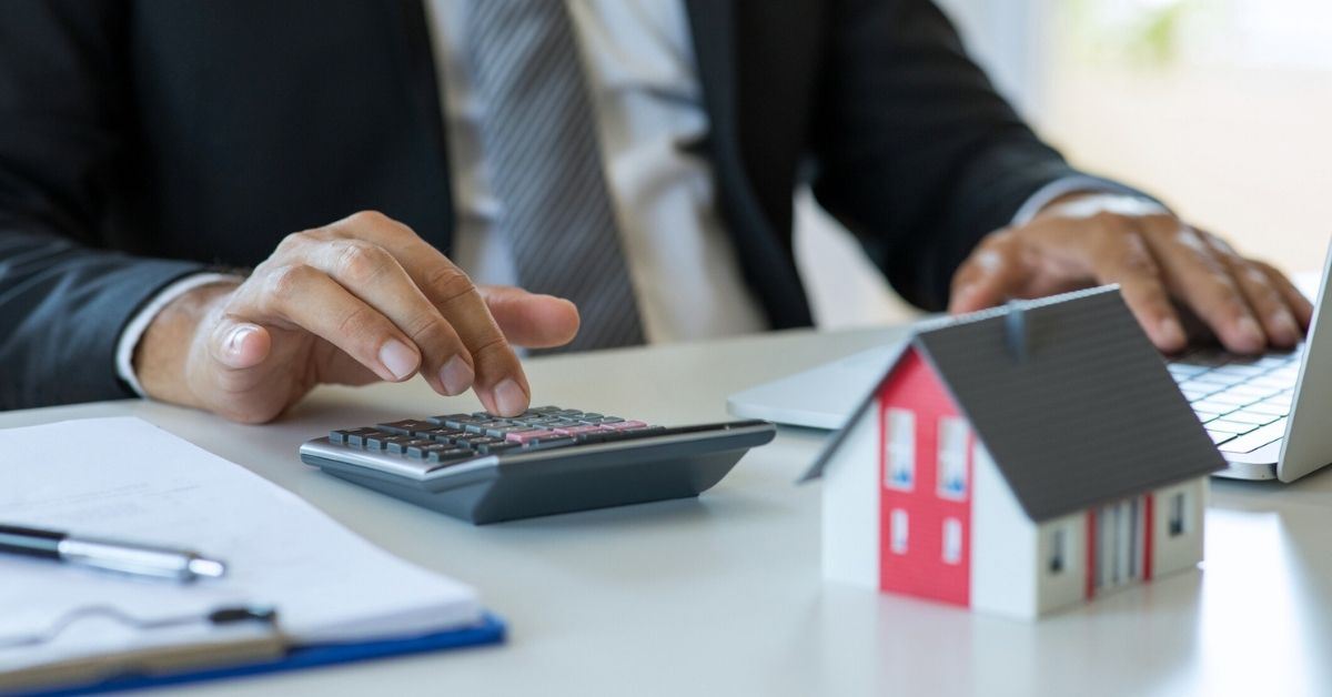 Realtor calculating the impact water damage has on the value of a client's home.